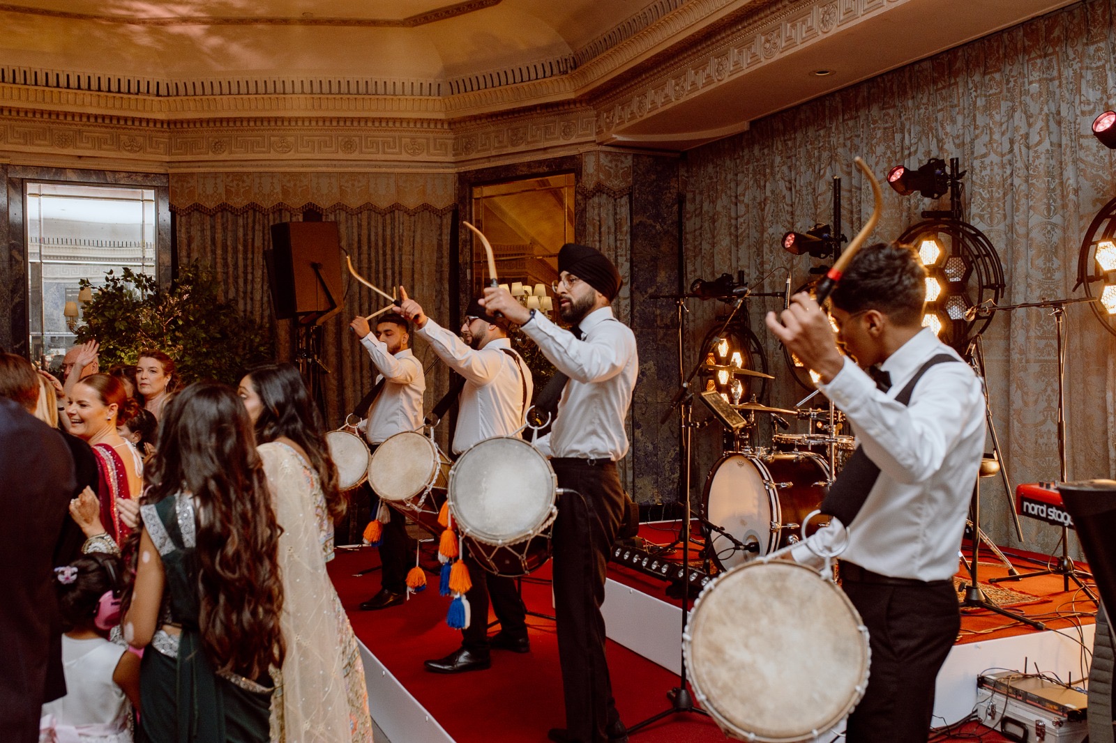 Dhol player mid-performance